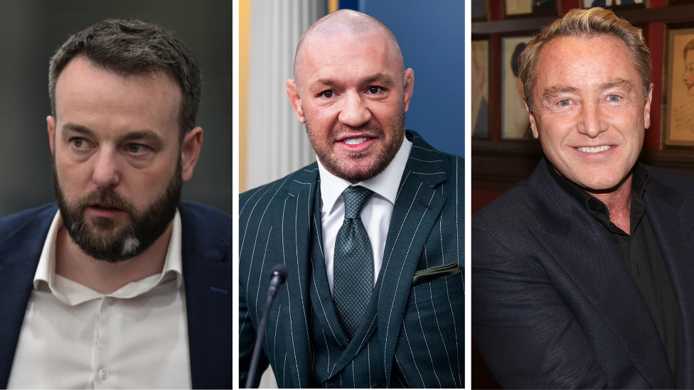 A composite image going left to right of Colum Eastwood, Conor McGregor and Michael Flatley. Eastwood is walking and has short dark hair, a beard with a small grey patch, a white collared shirt with the top button open and a navy blazer. McGregor, with a shaved hair and stubble, is speaking while at the White House. He is standing at a podium and is wearing a dark green and white pinstripe suit and waistcoat, a white collared shirt and a green patterned tie.