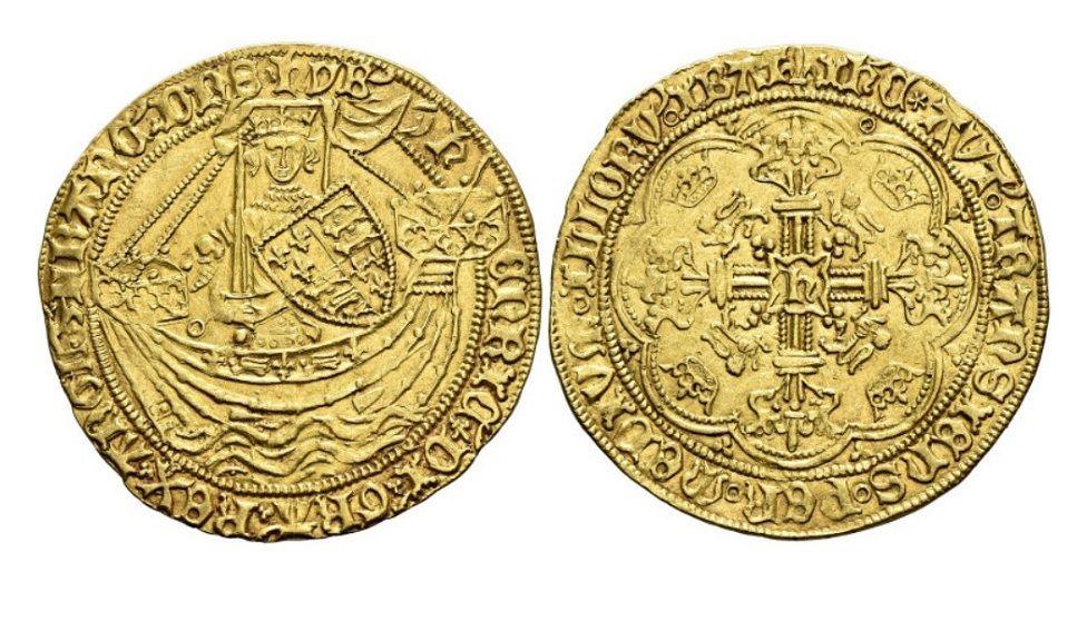 Some of the coins from the collection. They are gold and have old English words written on them, along with engravings of a man wearing a crown and carrying a shield in what appears to be a boat on the left. On the right the engraving looks to be of a coat of arms.