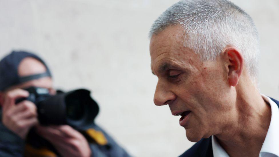 Tim Davie being photographed outside New Broadcasting House