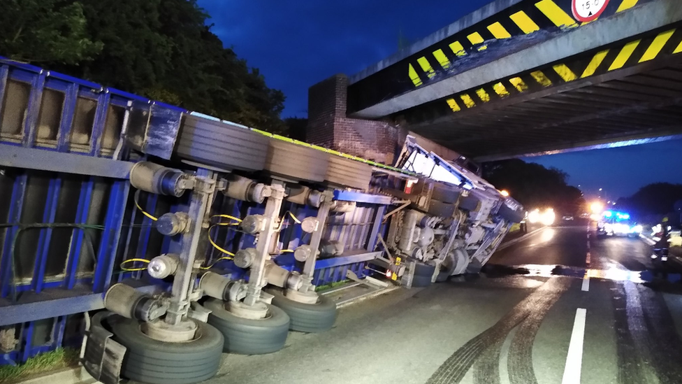 A lorry on its side on the A5 after hitting the Watling Street bridge in June 2022.