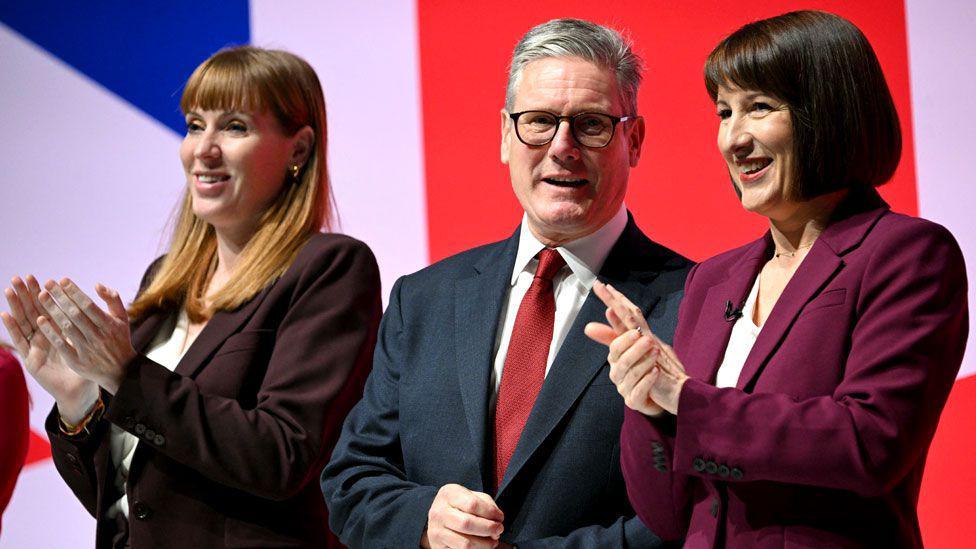 Deputy Prime Minister, and Secretary of State for Housing, Communities and Local Government Angela Rayner, Britain's Prime Minister Keir Starmer and Britain's Chancellor of the Exchequer Rachel Reeves on stage on the second day of the annual Labour Party conference in Liverpool, north-west England, on September 23, 2024.