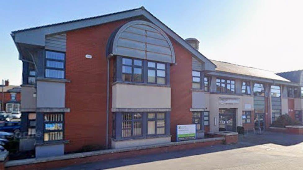 Adelaide Surgery's Gorton Street practice in Blackpool. It is a long two-storey redbrick and cream-rendered modern building.