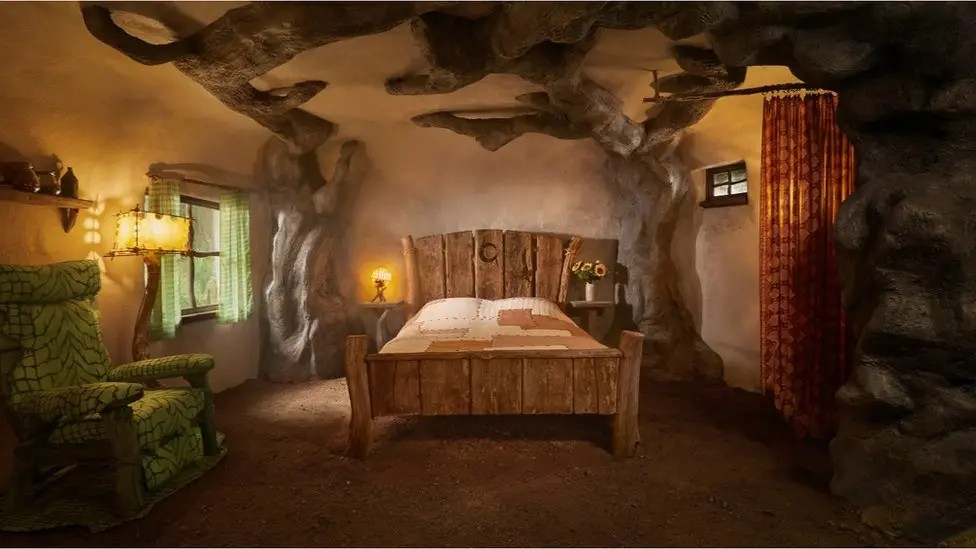 The inside of a hotel/b&b made to look like Shrek's house in the forest