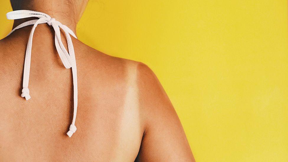 Tan lines on a woman's back