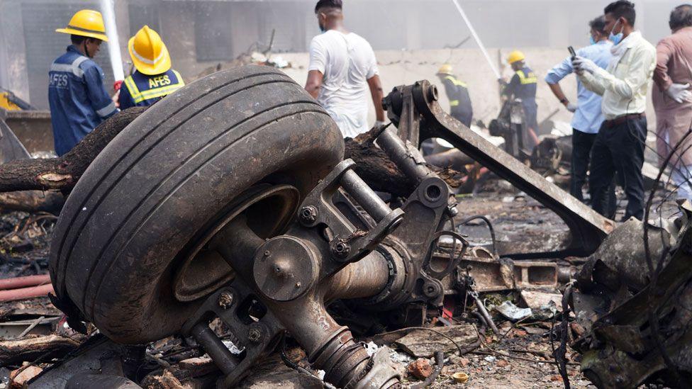 Debris at the site of a plane crash near Sardar Vallabhbhai Patel International Airport in Ahmedabad, Gujarat, western India, 12 June 2025. 