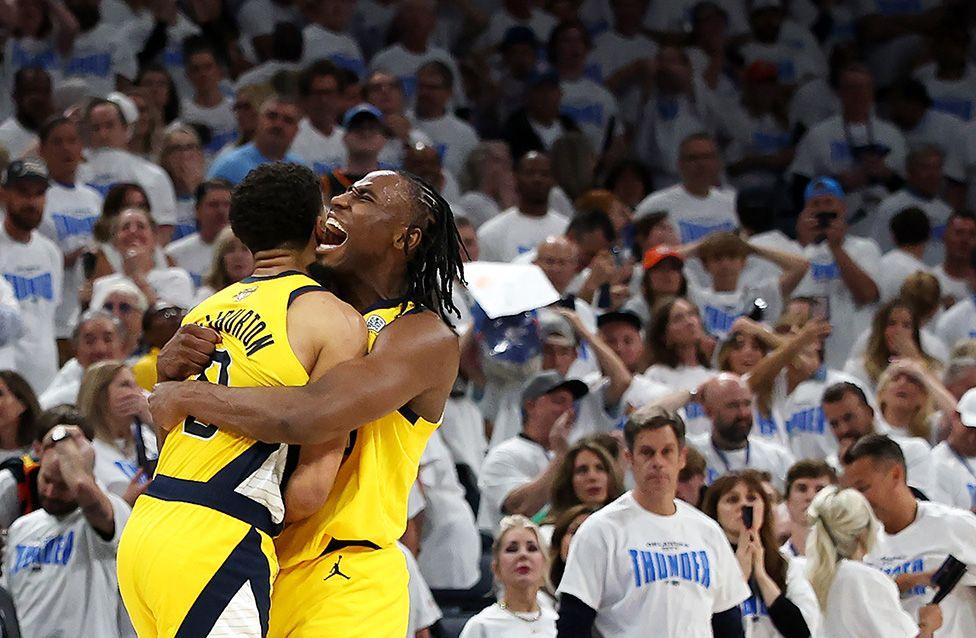 Tyrese Haliburton of the Indiana Pacers is congratulated by Aaron Nesmith after scoring a basket against the Oklahoma City Thunder during the fourth quarter in Oklahoma. Photo by Matthew Stockman