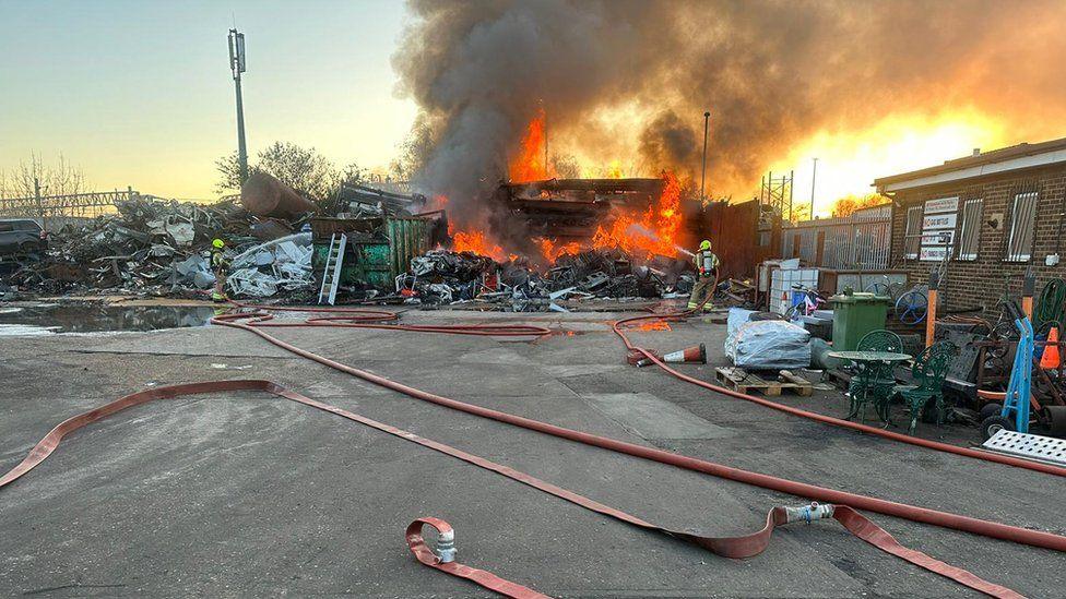 Firefighters at the scene of an industrial fire