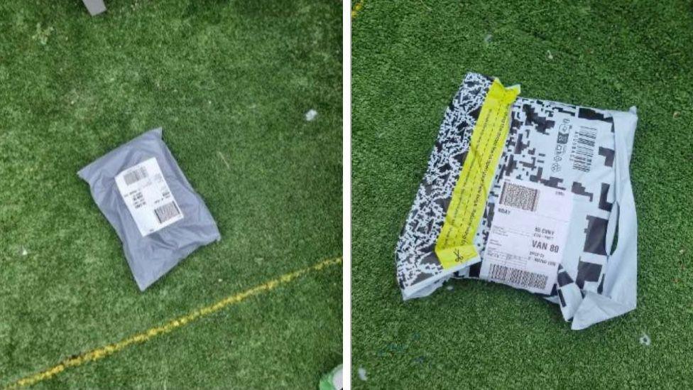 Two grey parcels are lying on a patch of green astro turf 