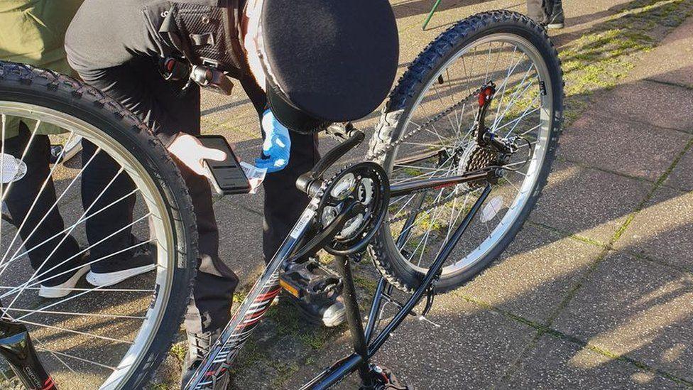 A photo of a bike being marked