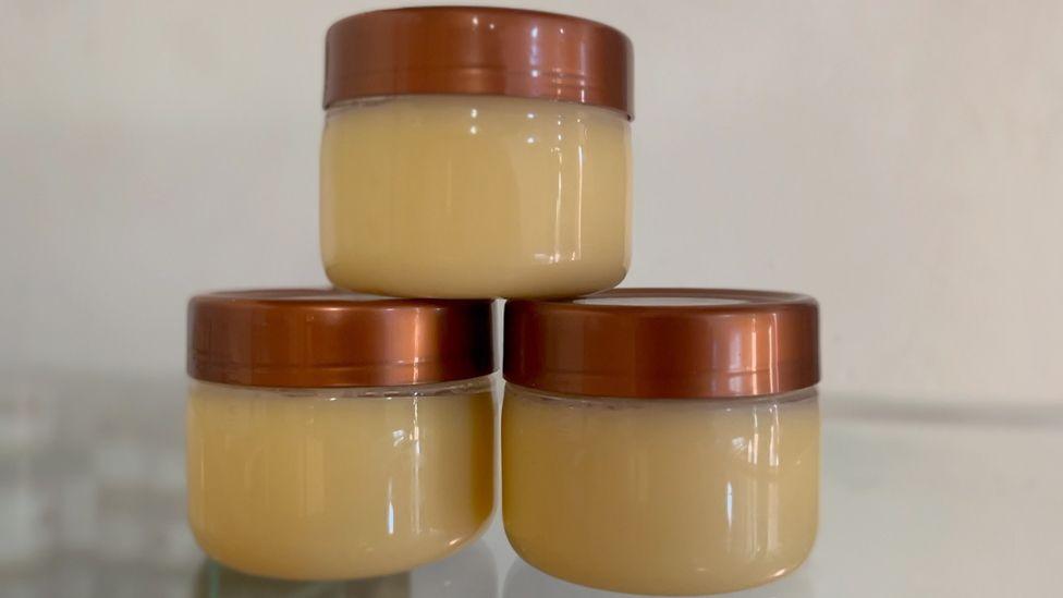 Three containers containing shea butter from Uganda