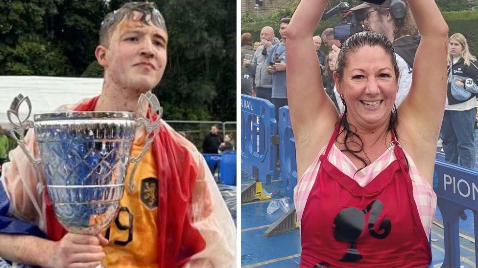 George Young at the Rose 'N, Bowl pub holds a trophy with a gravy-soaked face and draped in a gravy-stained flag. Christine Rogers, wearing a pink top and a red apron with a silhouetted head on it holds her hands in the air. Both were winners at the World Gravy Wrestling Championships