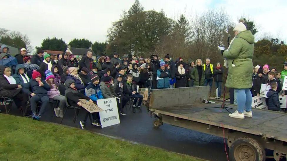 a crowd of people protesting