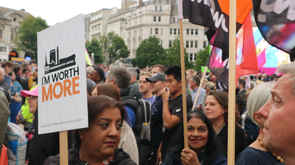 Protesters holding placards calling for Birmingham City Council staff in female-dominated roles to be paid the same as those in male-dominated roles