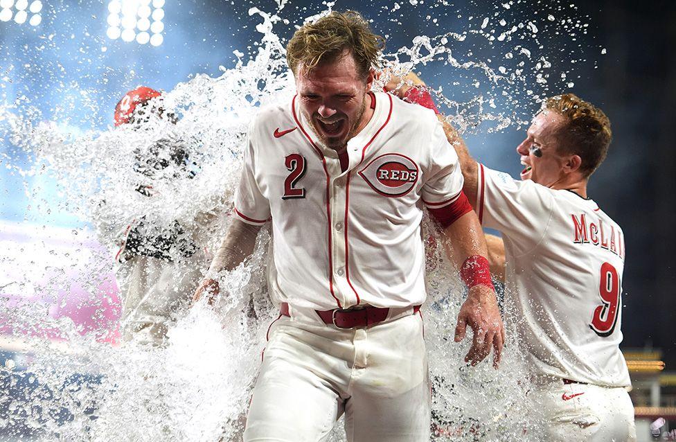 Gavin Lux of the Cincinnati Reds gets soaked after hitting a walk off RBI in the bottom of the eleventh inning against the New York Yankees. Photo by Jason Mowry