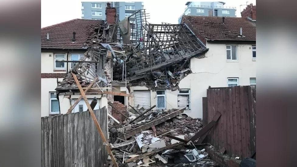 The damaged building from the rear