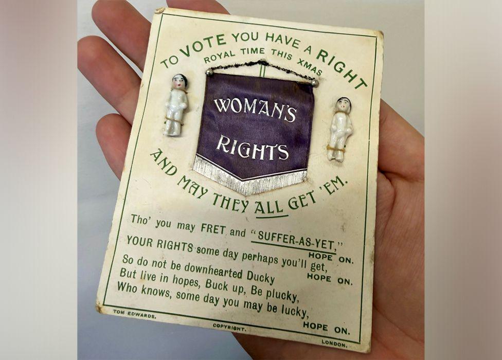 A Suffragette Christmas card dating from approximately 1910. It reads 'to vote you have a right and may they all get them'. The centre of the card reads 'woman's rights', with 'royal time this xmas' above it.