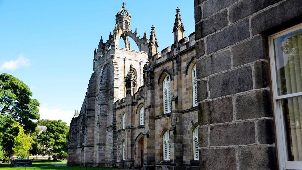 The University of Aberdeen, a historic building under a blue sky.