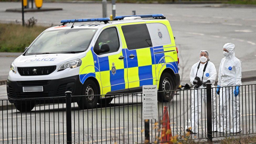 Forensic police officers attend the scene at Huntingdon Station after a stabbing attack on a train on November 02, 2025 in Huntingdon, England.