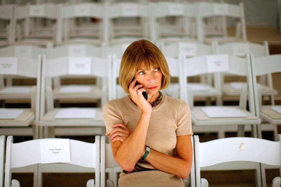 Vogue editor Anna Wintour speaks on a cell phone before the J. Mendel Spring 2008 collection during New York Fashion Week September 7, 2007.