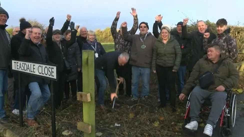 Volunteers at groundbreaking ceremony