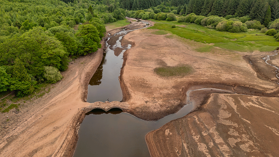 Aerial drone view looking down on the bridge and of reservoir
