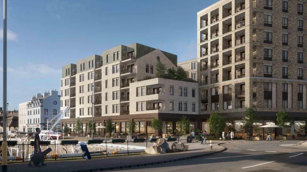 A CGI of a large brown brick modern development with greenery on the street and balconies, shows the development from the corner.