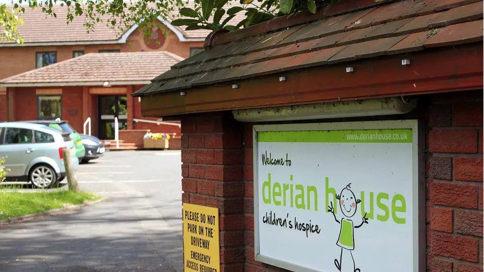 External view of Derian House Children's Hospice sowing sign with logo in green writing