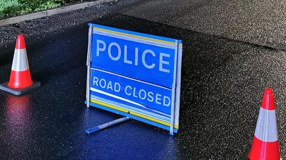 Police road closed sign