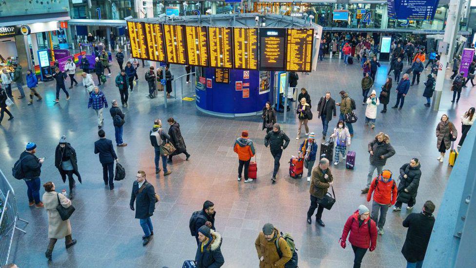 FILE IMAGE - Commuters arrive at Manchester Piccadilly railway station in Manchester, UK, on Thursday, Dec 8, 2022. 