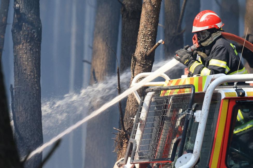 France fire crews face searing heat in battle to contain flames