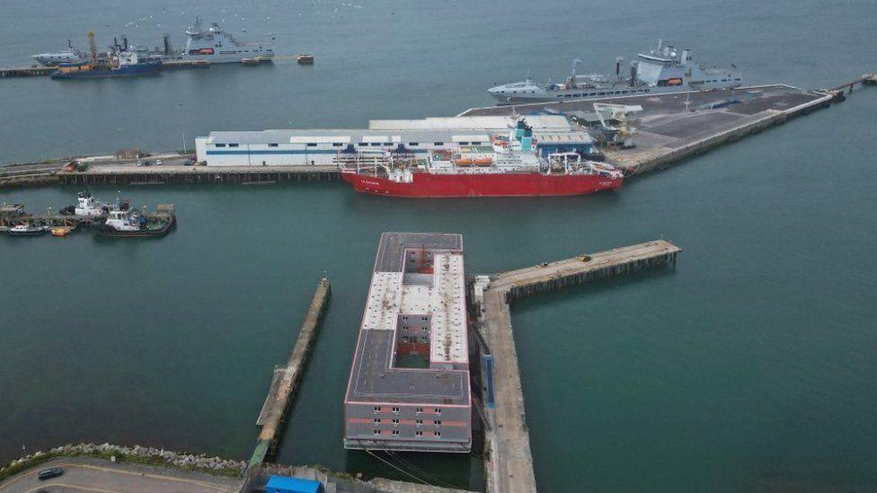 An aerial view shows the Bibby Stockholm barge moored at Portland Port.