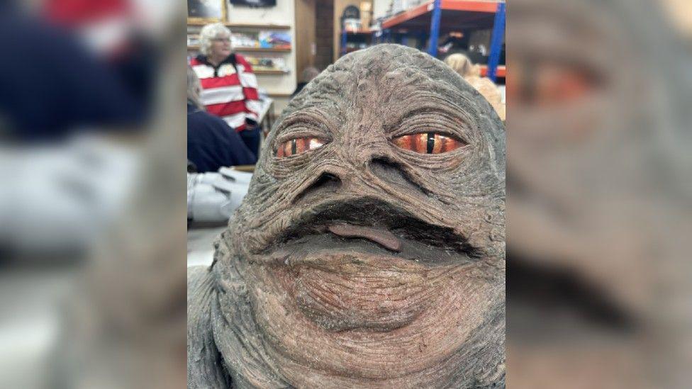 A close up of Jabba the Hutt from Star Wars.