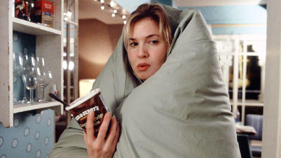 Renee Zellweger with a duvet over her head and a tub of Ben & Jerry's ice cream in her hand in Bridget Jones The Edge Of Reason in 2004