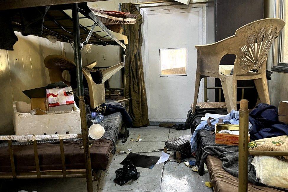 A bedroom with bunk beds which appears to be messy