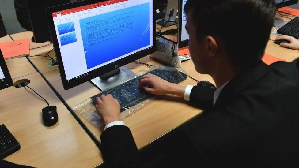 A school pupil at a computer