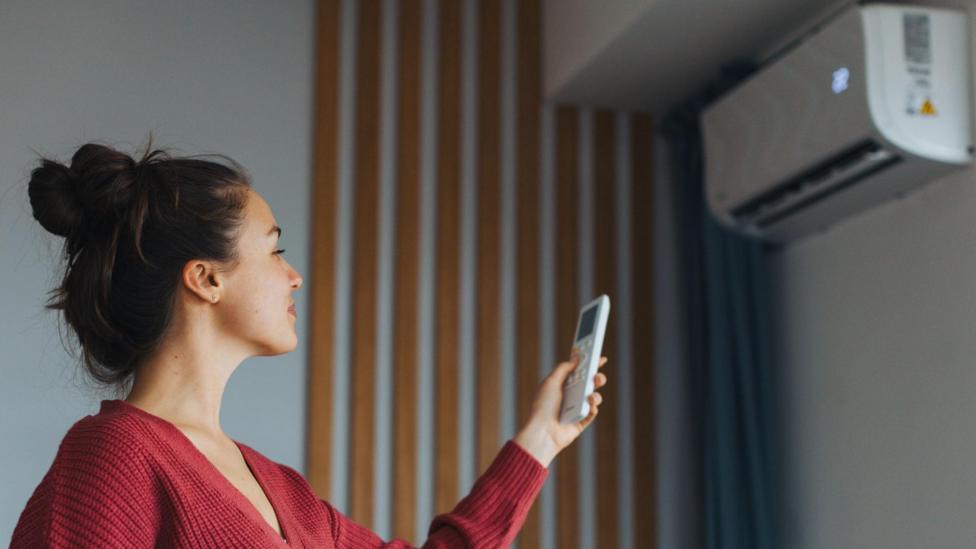 How can I get air conditioning in my home and how much does it cost?