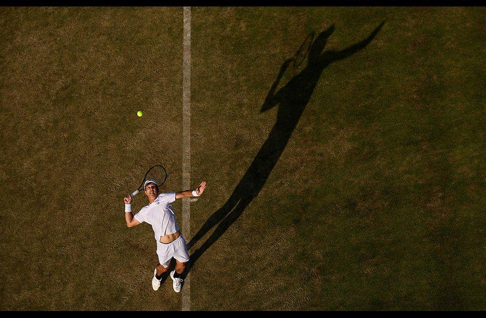 Mackenzie McDonald serves against Gael Monfils during the Men's Singles First Round match at Queen's. Photo by Julian Finney