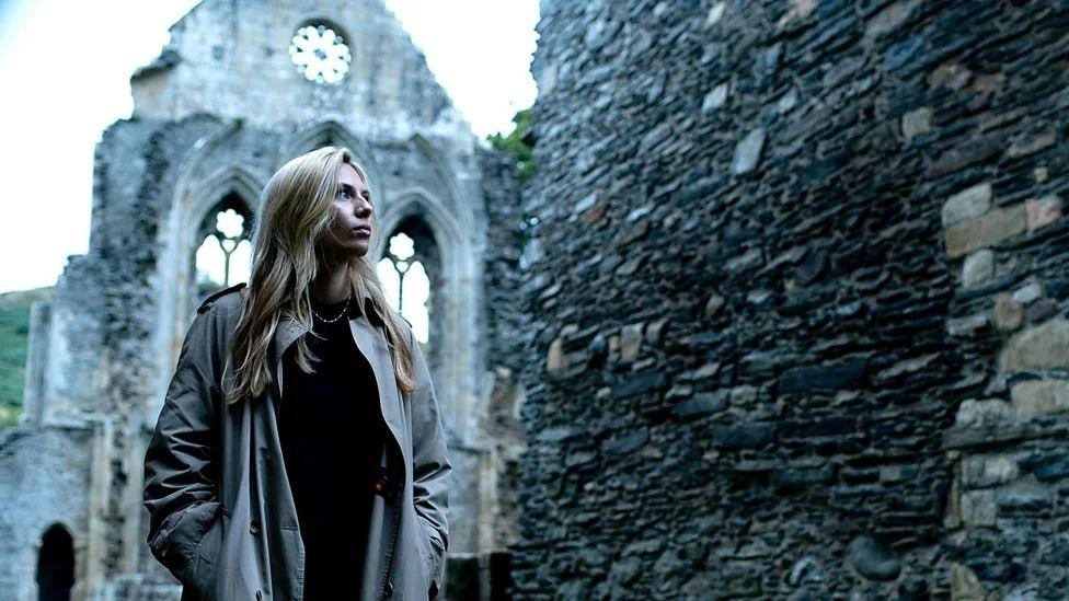 sian eleri in the ruins of a castle