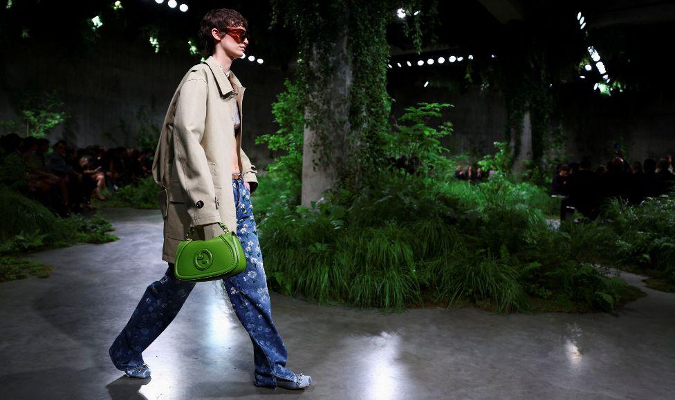 A model presents creations by Gucci at a fashion show in the Turbine Hall at Tate Modern, in London, Britain May 13, 2024. 