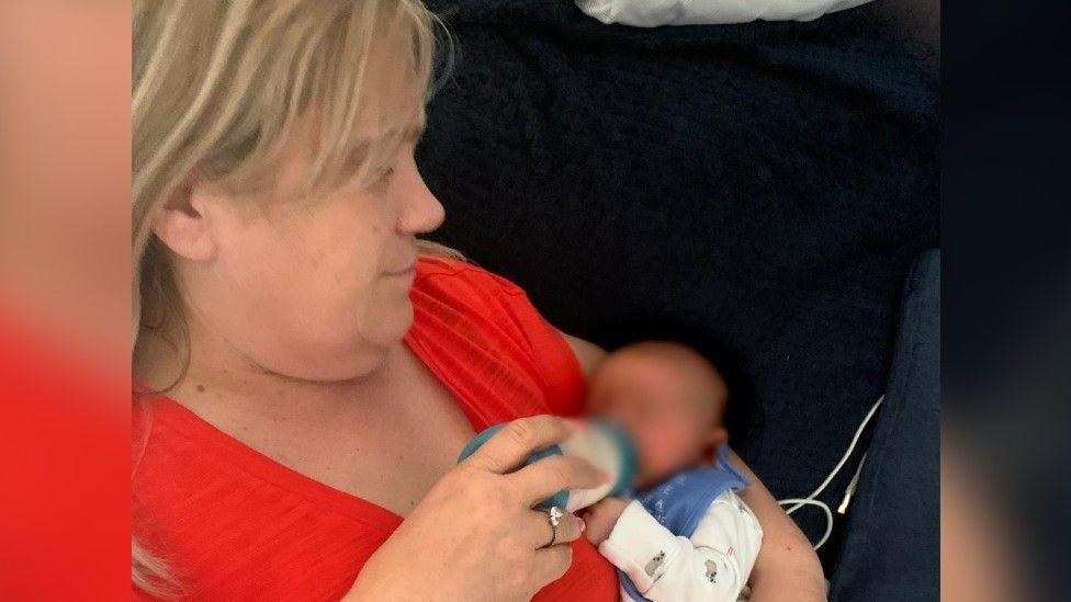 Janet Wilcock feeding one of the babies she fostered