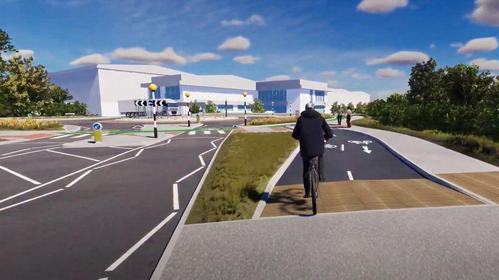 An animation showing a man on a bike approaching a 'Dutch-style' roundabout while riding in a cycle lane.