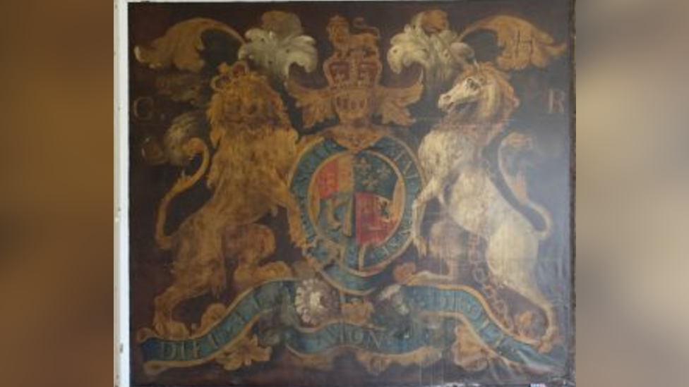 The older coat of arms is very faded, although the picture quality is poorer than the picture of the newer version.