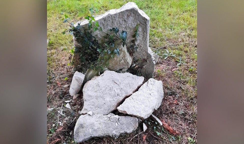 A shattered gravestone