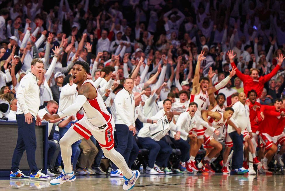 Caleb Love of the Arizona Wildcats celebrates after hitting the game-tying three-point shot against the Iowa State Cyclones at McKale Center in Tucson, Arizona