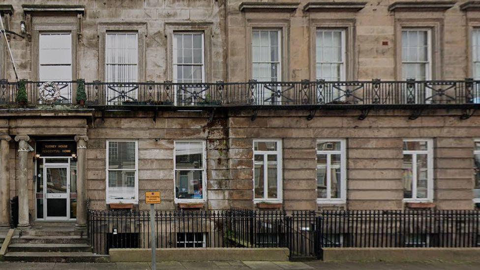 Rodney House on Canning Street is a yellow brick terraced building with large white sash windows
