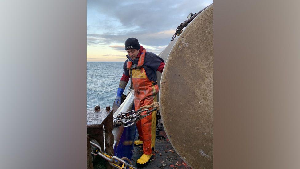 Peter working as master of his fishing boat, the Lily James