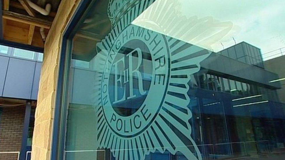 An insignia on glass at the entrance to the police's headquarters.
