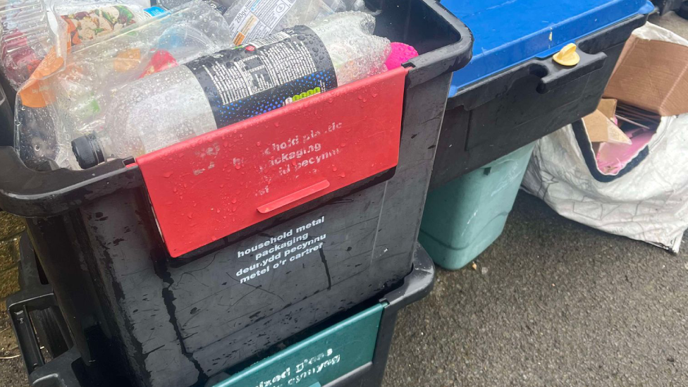 piles of recycling bins