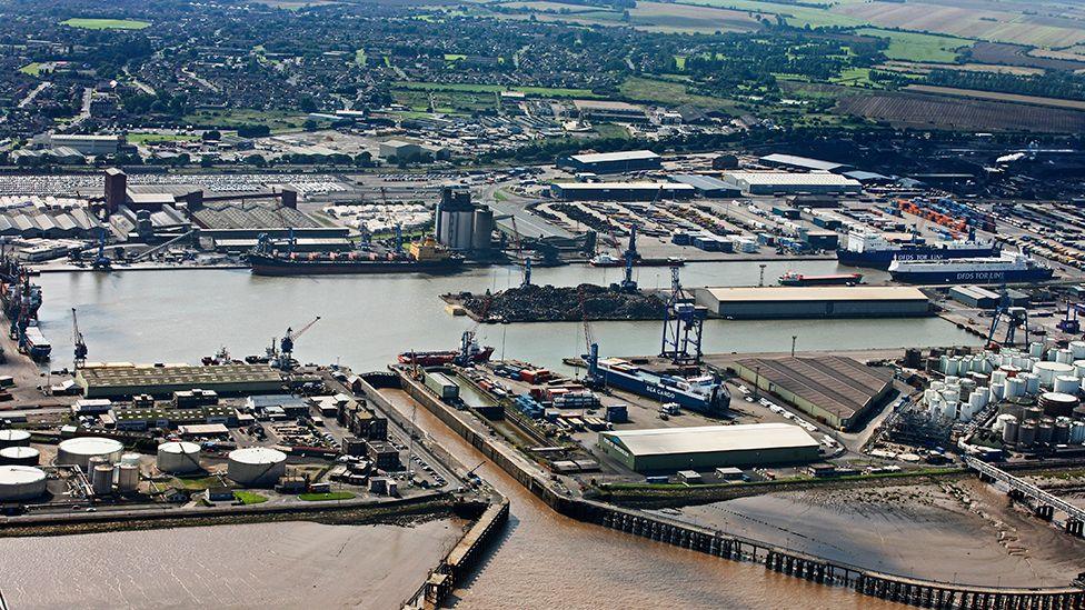Aerial view of Immingham with the docks in the foreground and houses and other buildings in the background