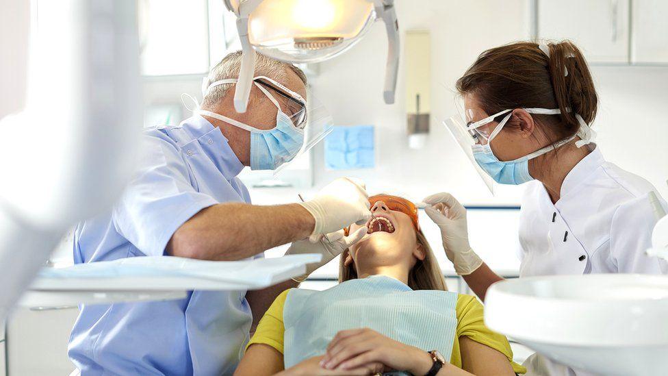 A photo of a girl having dental treatment